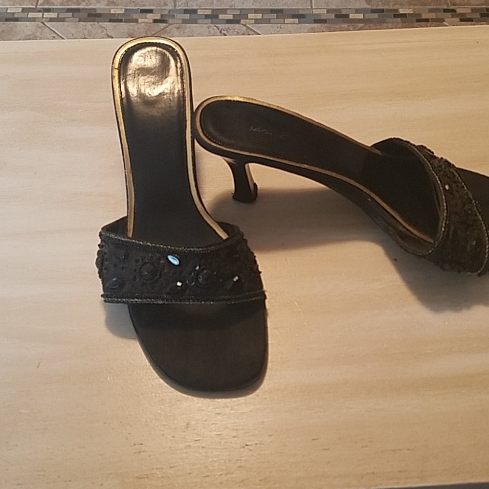 Black  slingbacks open front saddles.